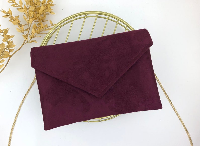 Plum burgundy envelope clutch ideal for storing the essentials for an evening image 7