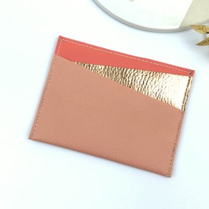 Coral and copper bank card holder for women, perfect for storing your credit card.