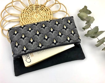 Black and gold cover pouch perfect for protecting your belongings or your paperbacks and paperbacks