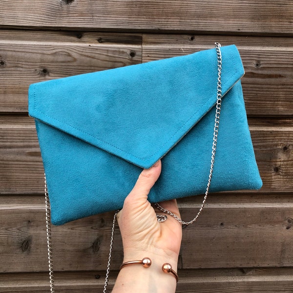 Pochette da donna turchese ideale per riporre gli oggetti essenziali