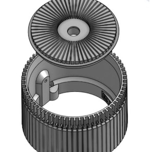 May include: A gray, cylindrical mechanical component with a ridged outer surface and a circular top. The top piece has a series of radial lines emanating from a central hole. The component appears to be made of metal.