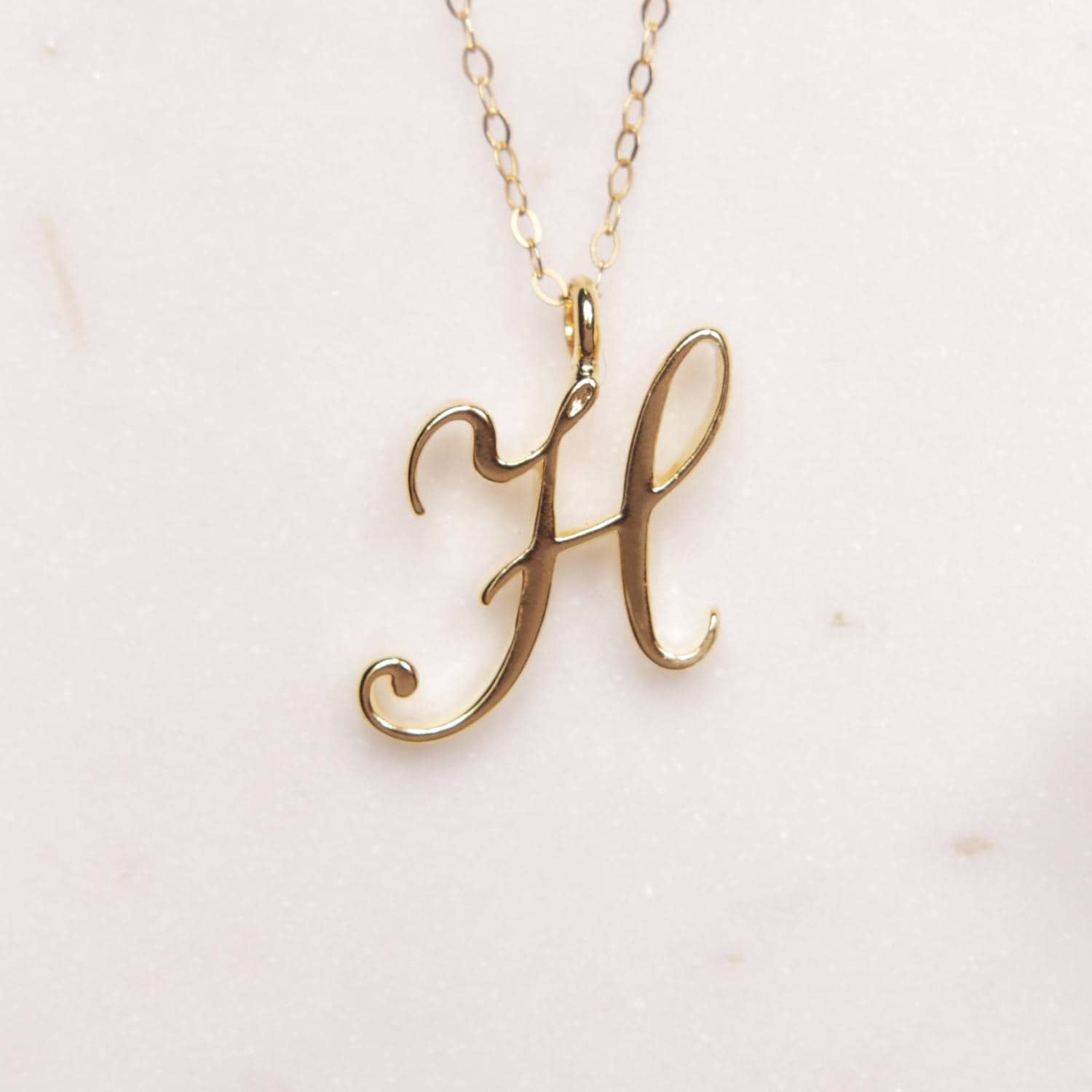 Buy Gold Plated H- Initial Pendant Necklace by MNSH Online at Aza Fashions.
