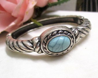 Silver-colored vintage cuff with faux turquoise