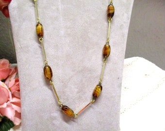 Decorative long flapper necklace with gold-colored brown marbled glass stones, length 78 cm