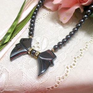 Noble pearl necklace faux hematite with bow crystal stones grey dark grey bow pendant grey pearls