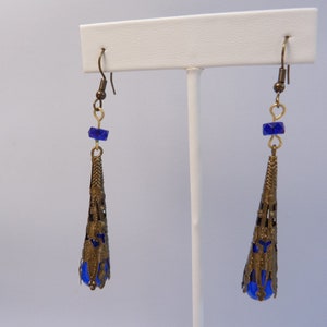 long filigree royal blue dangle earrings, cobalt blue glass and ornate bronze bead caps  and ear wires