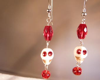 dangling skulls earrings