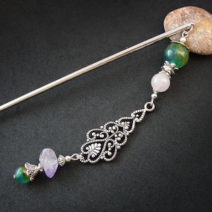 Hair stick with green and purple stones