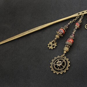 Beaded hair stick with red tiger's eye stone, gears cogs charms, dangling ornaments