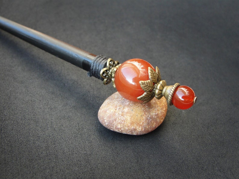 Wooden based hairpin with two agate gemstones in brown color. The stick length is adjusted to customers' specifications.