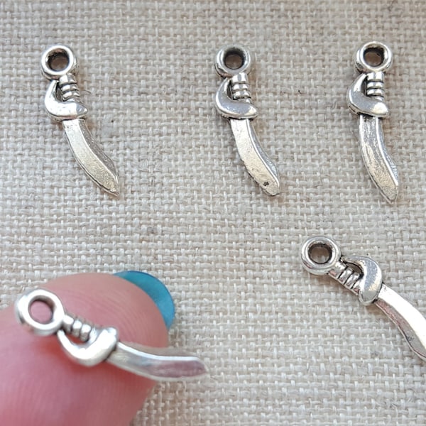 Sabre Charms X 5.  Dagger Charms. Sword Charms. Knife Charms. Tibetan Silver Tone.  UK Seller