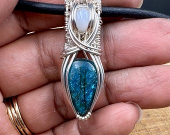 Dioptase wrapped in sterling silver with moonstone
