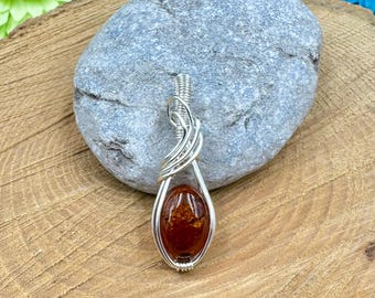 Amber Pendant wrapped in silver german wire