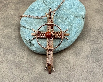 Cross necklace wrapped in copper