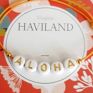 Pulseira simbólica "Aloha"... sinônimo de boas-vindas, benevolência em havaiano... amuleto da sorte, grigri... cordão ajustável para todos os tamanhos.