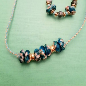 Talisman necklace..chic ethnic grigri..genuine old African beads..and gold-plated beads..on adjustable length cord.rare