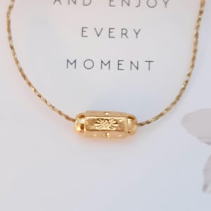 Shine talisman necklace..protective amulet..lucky eye..precious, fine, delicately engraved..on adjustable gold linen cord..