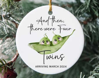May include: White ceramic Christmas ornament with a green pea pod design. The pod has two peas with faces and the text "And then, there were four Twins arriving March 2024".