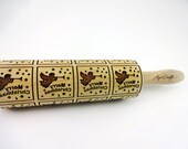 FLYING ANGELS Rolling pin. Embossing rolling pin with Christmas symbols. Christmas gingerbread cookies. Christmas tree, star, snowflake