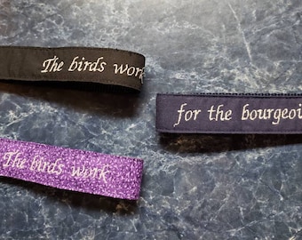 The birds work for the bourgeoisie embroidered fob keychain