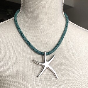 Star Fish Pendant on Blue Suede Cord. Sterling Silver.
