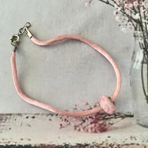 Pink Lamp Work Bead on Satin Cord Bracelet.