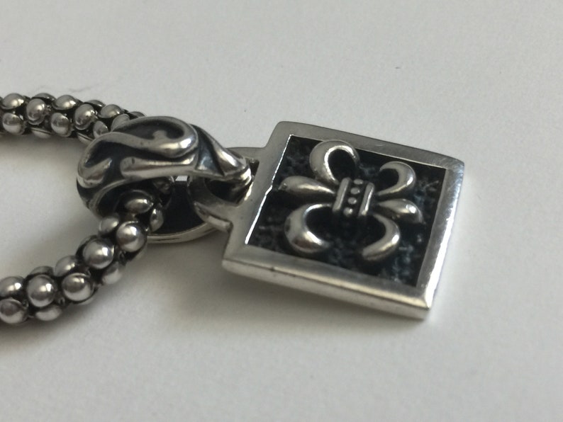 Silpada Fleur De Lis Sterling Silver Pendant on Black Leather.