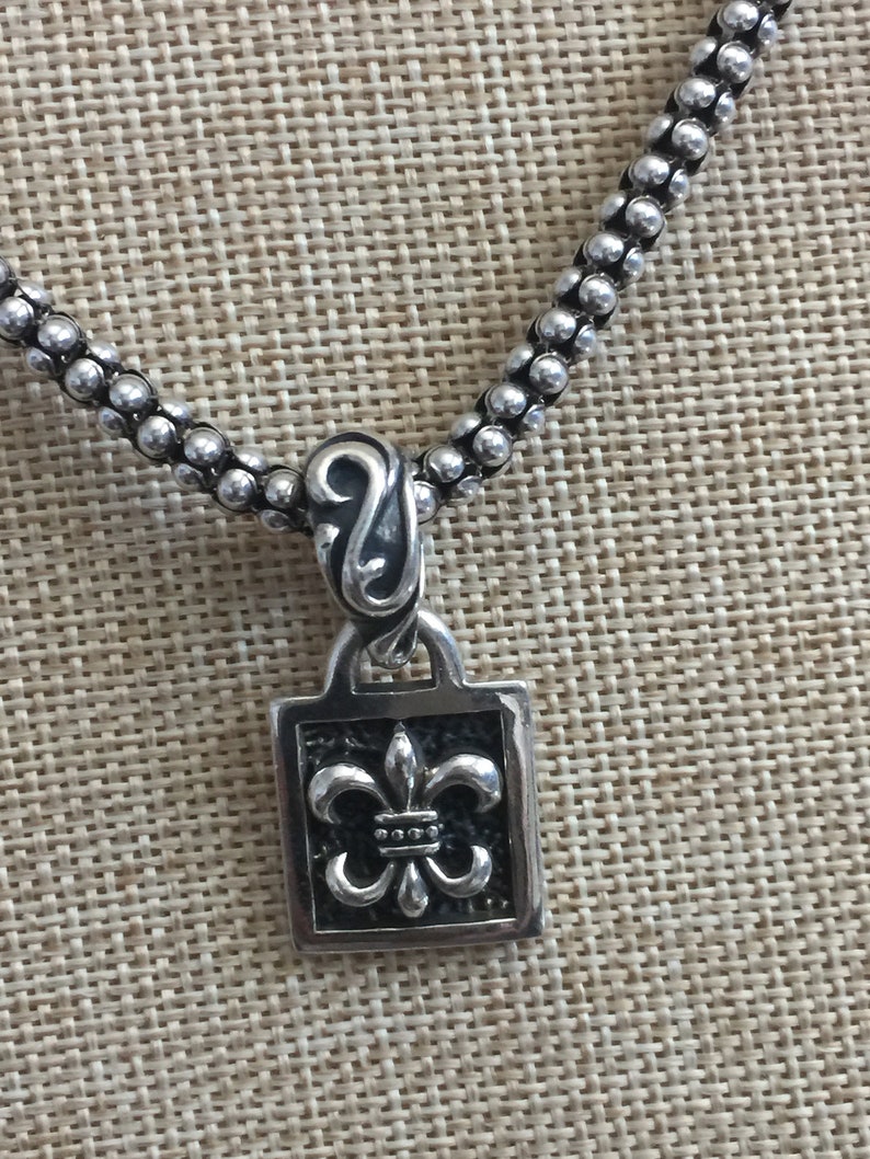 Silpada Fleur De Lis Sterling Silver Pendant on Black Leather.