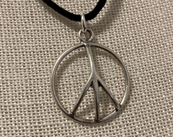 Peace Pendant on Black Suede Cord.