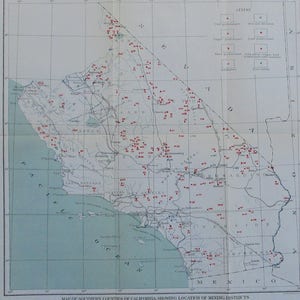 May include: A vintage map of Southern California counties, showing the location of mining districts. The map features a detailed depiction of the region, with red dots indicating mining locations. The map includes a legend and a list of mining districts.