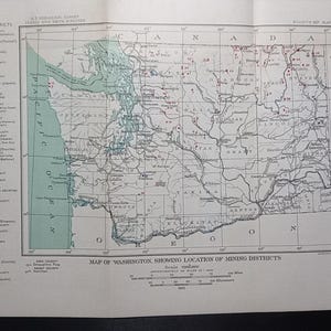May include: Vintage map of Washington State showing the location of mining districts. The map features a detailed depiction of the state's geography, with labeled districts and a legend indicating mineral locations. The map is printed on aged paper.