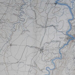 May include: A black and white map with blue lines showing rivers and streams. The map shows the area around Harrisonburg, Virginia, with the text "Harrisonburg, Va." and "Harrisonburg Town" visible.