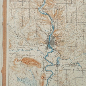 May include: A vintage map of Wausau, Wisconsin, showing the river, surrounding hills, and the text "EROSION CYCLES: PART OF WAUSAU (WIS.) SHEET, WITH SECTION A-B".