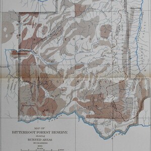 May include: A vintage map of the Bitterroot Forest Reserve, showing burned areas. The map, dated 1890, features a detailed illustration with various shaded regions indicating areas burned between 1719 and 1850. Includes a scale and legend.