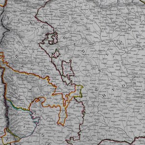 May include: An antique map of the Bombay Presidency in India, featuring detailed geographical information. The map is in black and white with colored borders, showcasing regions and place names. The map is a historical document.