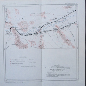 May include: A vintage U.S. Geological Survey map of the Yuma, Arizona area. The map features detailed topographical information, including contour lines, rivers, and geological formations. The map includes a scale in inches and miles, and a legend explaining the different geological features.