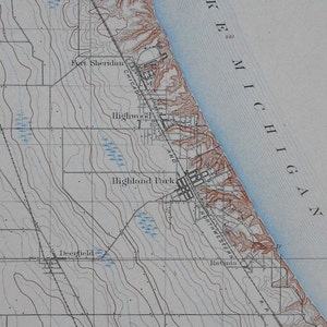 May include: A vintage topographic map featuring the shoreline of Lake Michigan. The map shows the cities of Fort Sheridan, Highwood, Highland Park, and Deerfield. The map has contour lines and labels such as "Chicago" and "Northwestern".