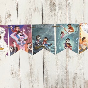 May include: A colorful banner with images and text from the Disney Pixar movie Coco. The banner features scenes from the movie, including Miguel playing the guitar, Hector and Miguel, and the Land of the Dead. The text on the banner includes "Remember Me" and "I have a great great grandfather".