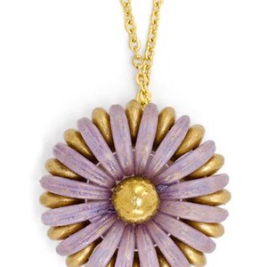 May include: A gold chain necklace with a purple and gold flower pendant. The flower has a textured, layered look and is made of polymer clay.