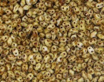 MiniDuo, Opaque White Picasso, 2 Hole Seed Bead. (364-24-T0300), 2mmx4mm, 9 grams