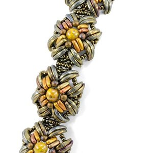 May include: A gold and silver beaded bracelet with a floral design. The bracelet has a clasp closure and is made with small, round beads. The bracelet is a statement piece and would be a great addition to any jewelry collection.
