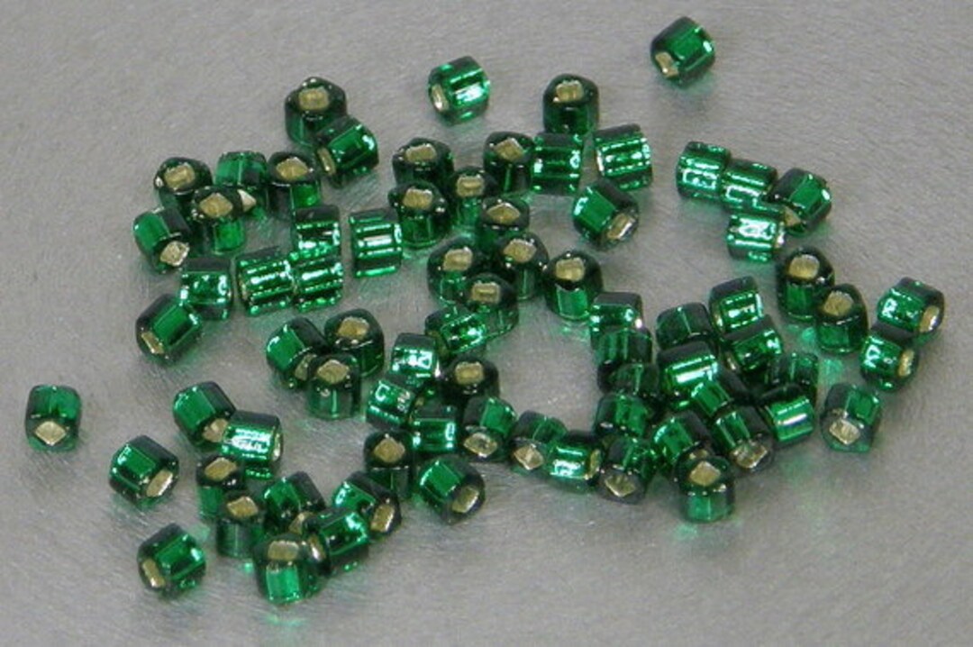 Toho 1.5mm Cube, Silver Lined Emerald Green (36), 10 Grams Toho 1.5mm Cube, Silver Lined Emerald Green (36), 10 Grams