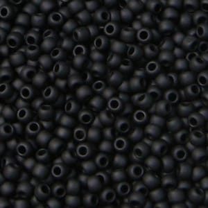 May include: A close-up shot of a pile of matte black seed beads. The beads are small, round, and have a hole running through the center. They are densely packed together, creating a textured surface. These beads are suitable for jewelry making and crafts.