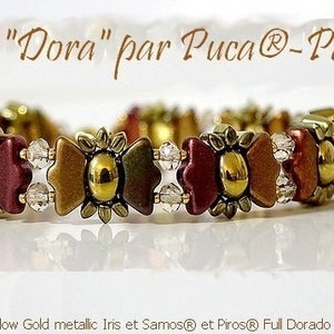 May include: A gold, brown, and red beaded bracelet with a butterfly design. The bracelet is made with Puca beads and is labeled "Bracelet "Dora" par Puca®-Paris".
