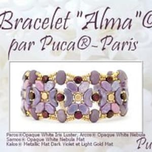 May include: A bracelet called "Alma" by Puca Paris, featuring a design of purple, white, and gold beads. The bracelet is made with Paros Opaque White Iris Luster, Arcos Opaque White Nebula, Samos Opaque White Nebula Mat, and Kalos Metallic Mat Dark Violet and Light Gold Mat beads.