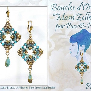 May include: A pair of gold earrings with a square design featuring blue and green beads. The earrings are labelled "Boucles d'Oreilles "Mam'Zelle"@ par Puca@-Paris".