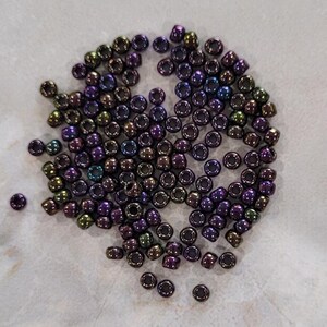 Toho 8/o Round Purple Iris Metallic (TR-8-85), choice of 10 grams or 23 grams