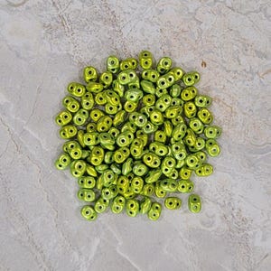 SuperDuo Metalust Electric Green, 2 hole Beads, (duo523980-24210), 2.5mmx5mm, 9 grams