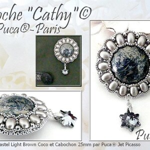 May include: A detailed brooch design, featuring a central stone with a dark blue and gray pattern, surrounded by silver-colored beads. A dangling, star-shaped crystal hangs below. The text "Broche Cathy" and "par Puca®-Paris" are visible.