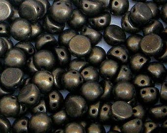 May include: A close-up of a pile of dark brown glass beads. The beads are round and have a smooth, shiny finish. They are perfect for jewelry making or other craft projects.